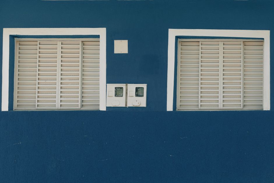 Painted trim and window on a house exterior