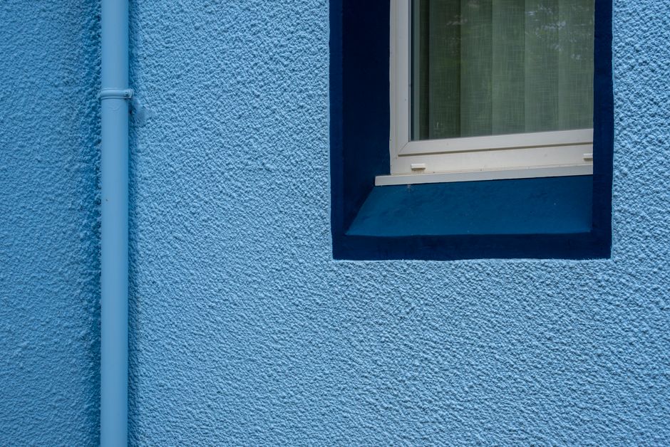 Close view of a freshly painted wall and window frame