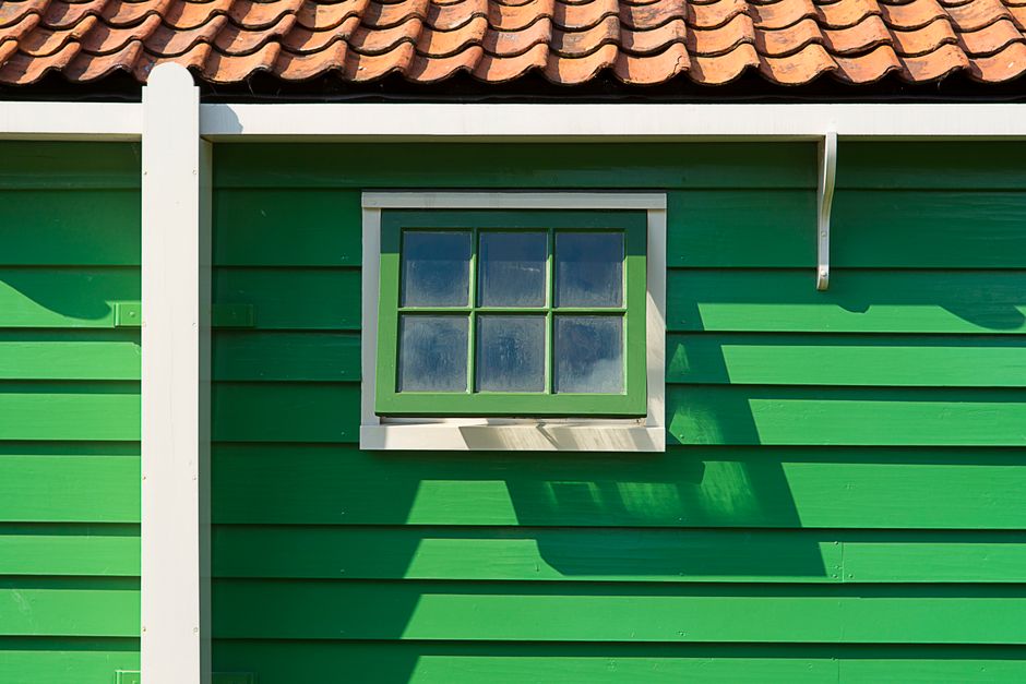 Painted house wall in bright daylight