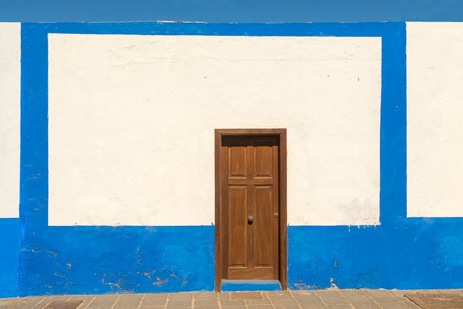 Painted trim and window on a house exterior